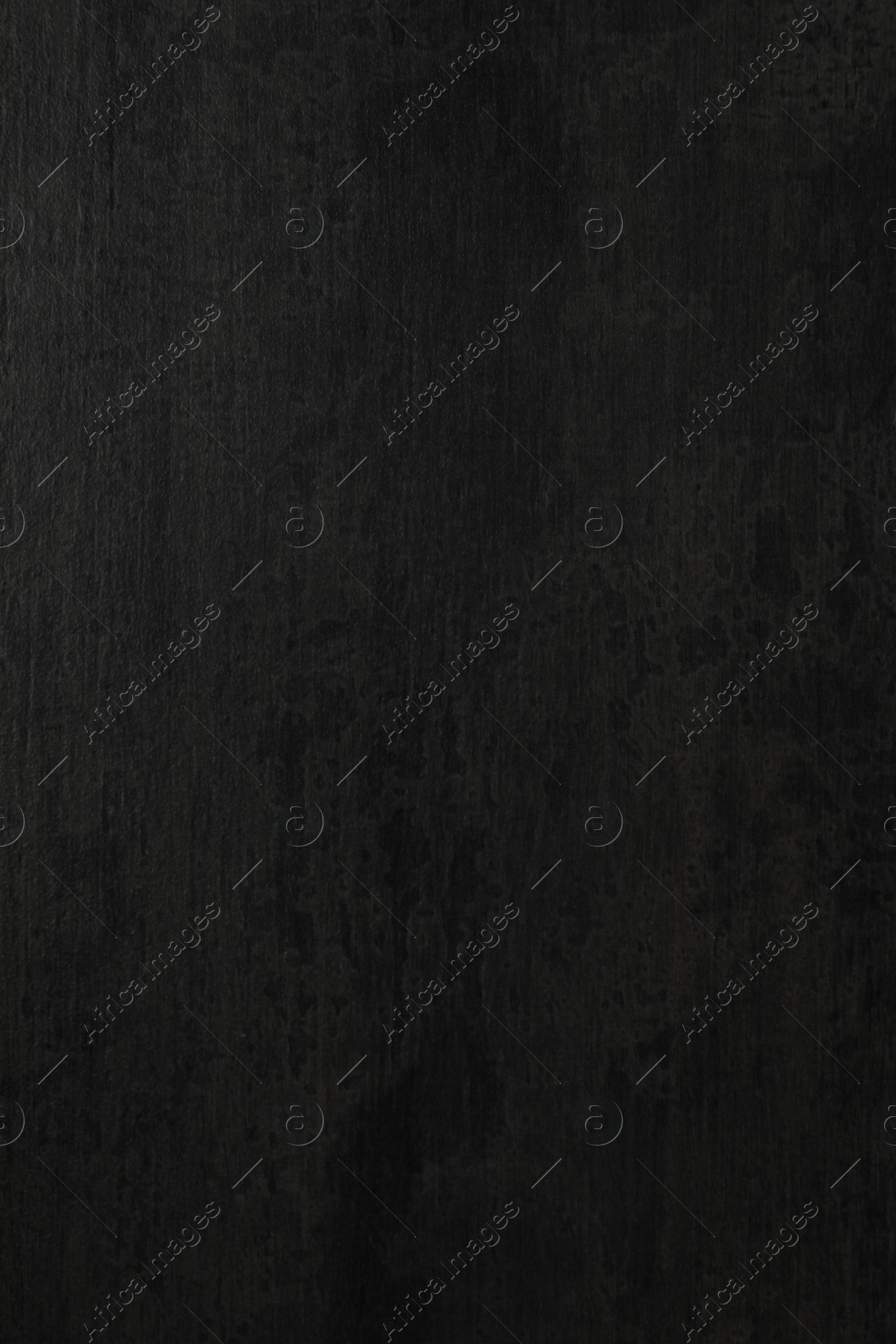 Photo of Texture of black stone surface as background, closeup