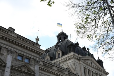 LVIV, UKRAINE - MAY, 04, 2022: Theatre of Opera and Ballet against cloudy sky, low angle view