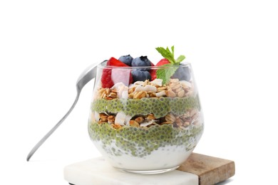 Photo of Tasty oatmeal with chia matcha pudding and berries on white tiled table, closeup. Healthy breakfast