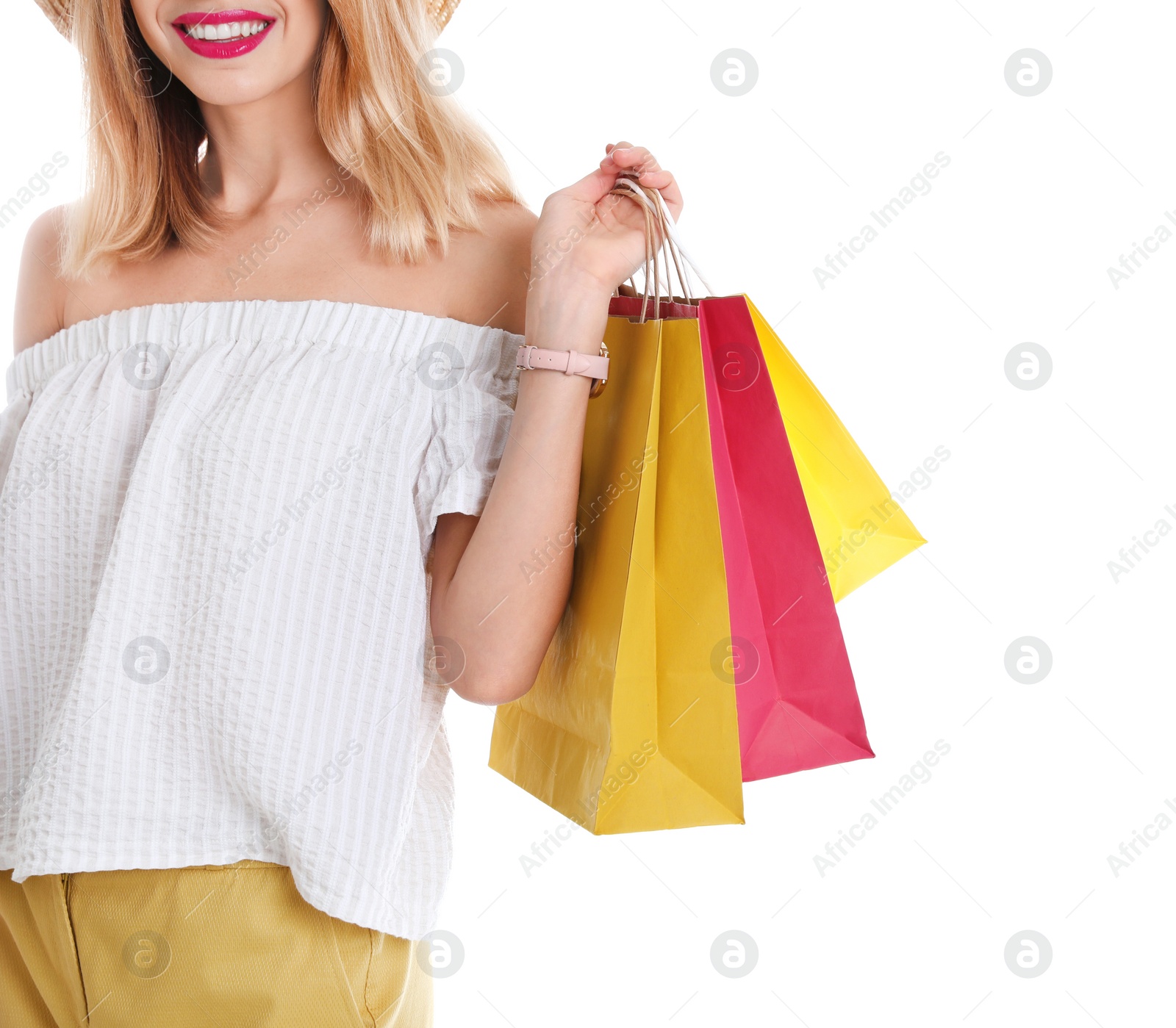 Photo of Young woman with shopping bags on white background, closeup