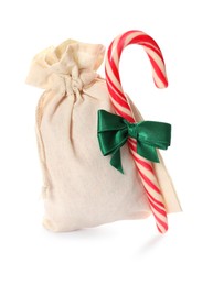 Photo of Small bag with candy cane and green ribbon isolated on white. Christmas advent calendar