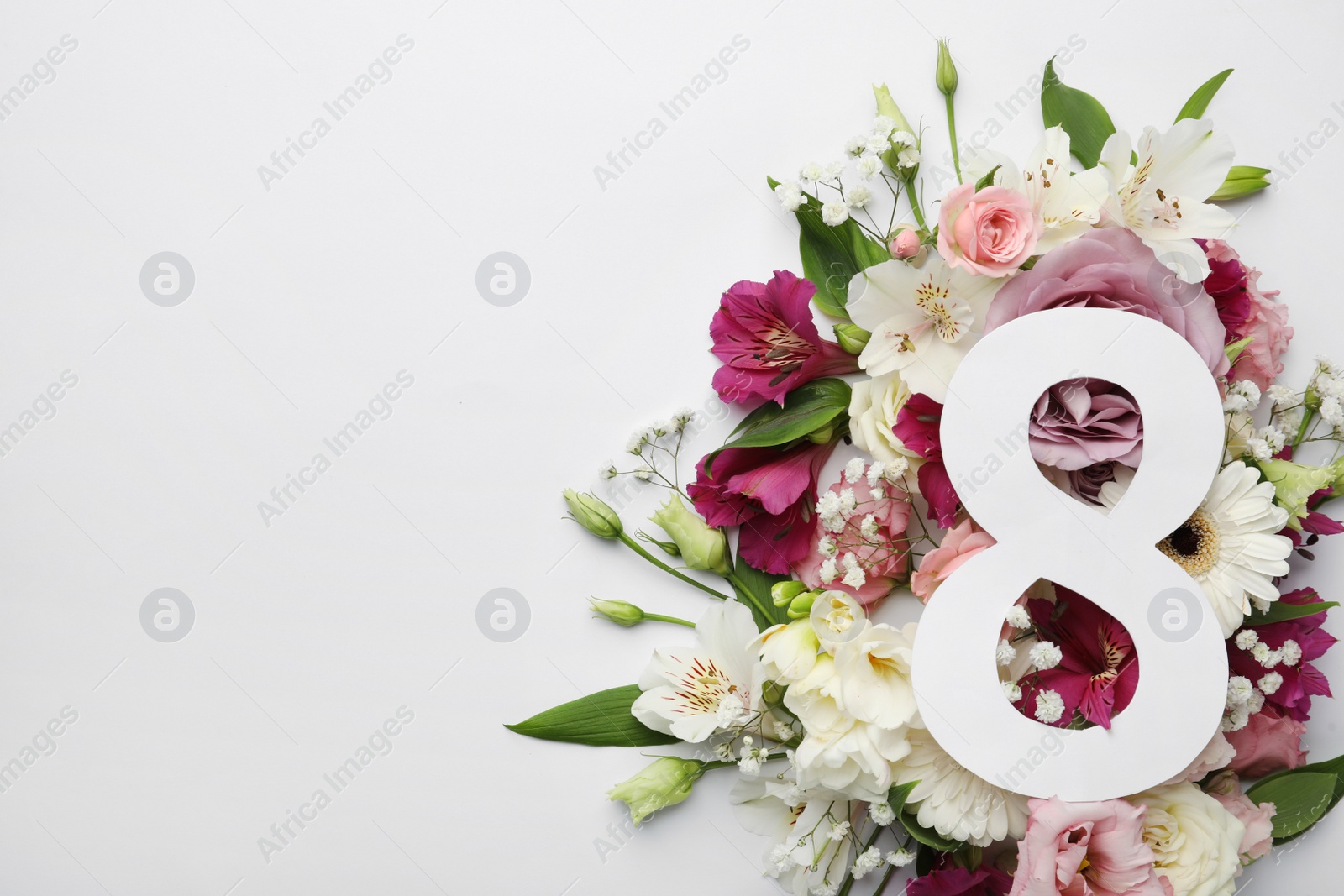 Photo of 8 March greeting card design with beautiful flowers on white background, flat lay and space for text. International Women's day