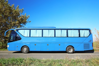 Modern blue bus on road. Passenger transportation