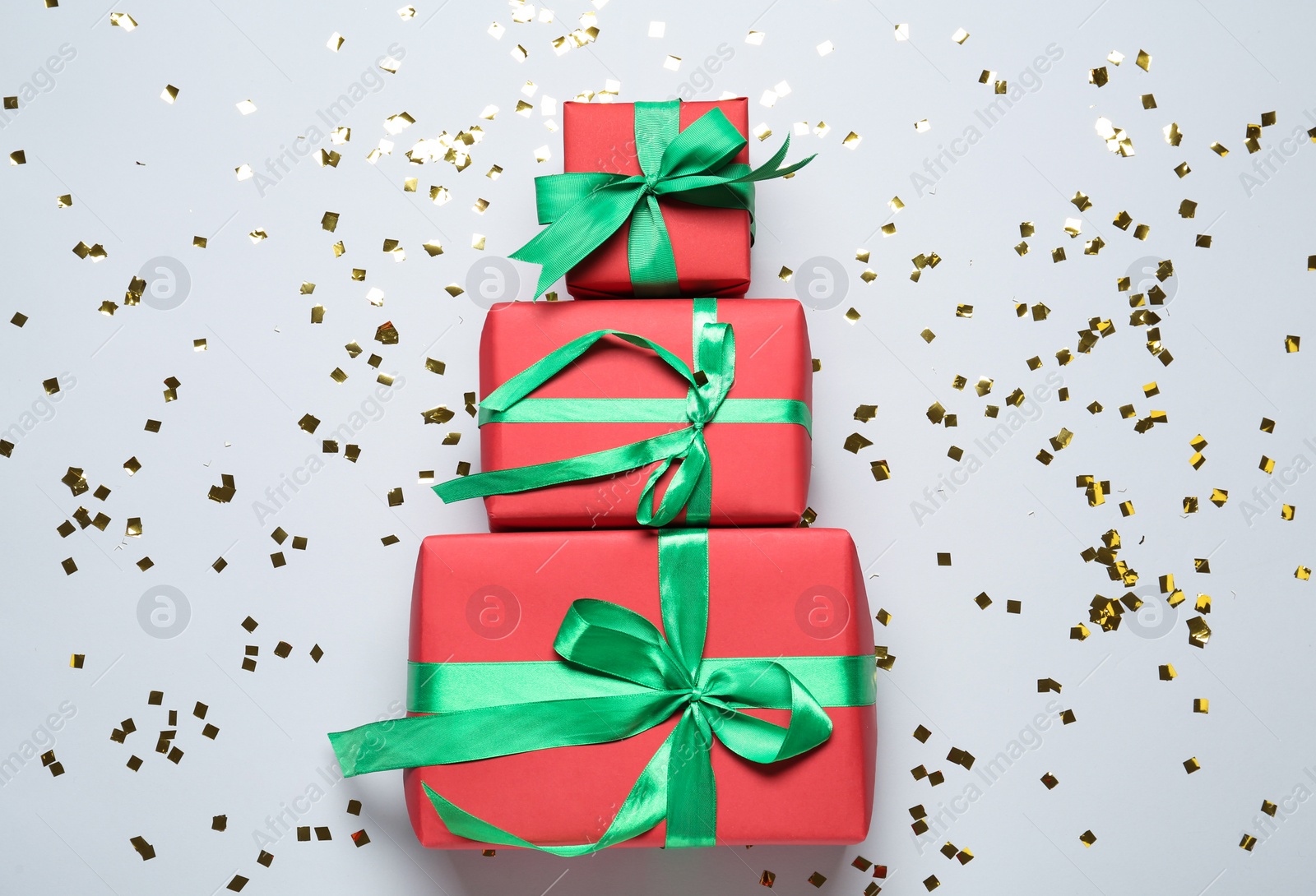 Photo of Christmas tree made with different gift boxes on white background, flat lay