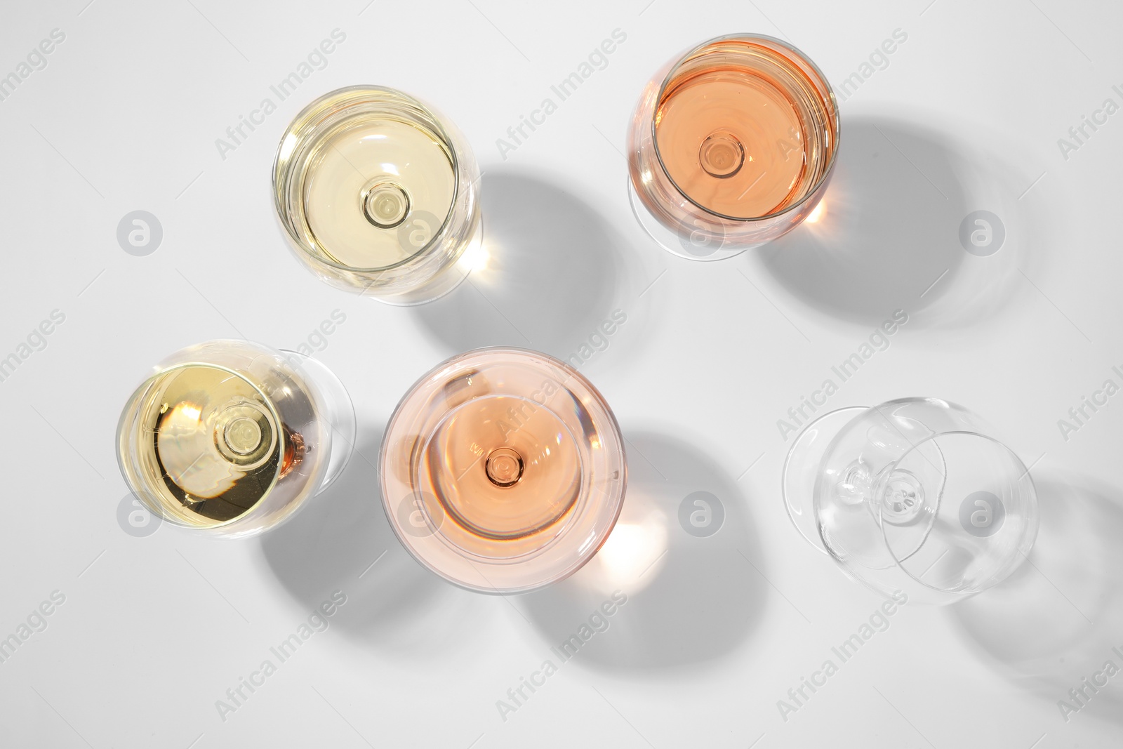Photo of Tasty different wines in glasses isolated on white