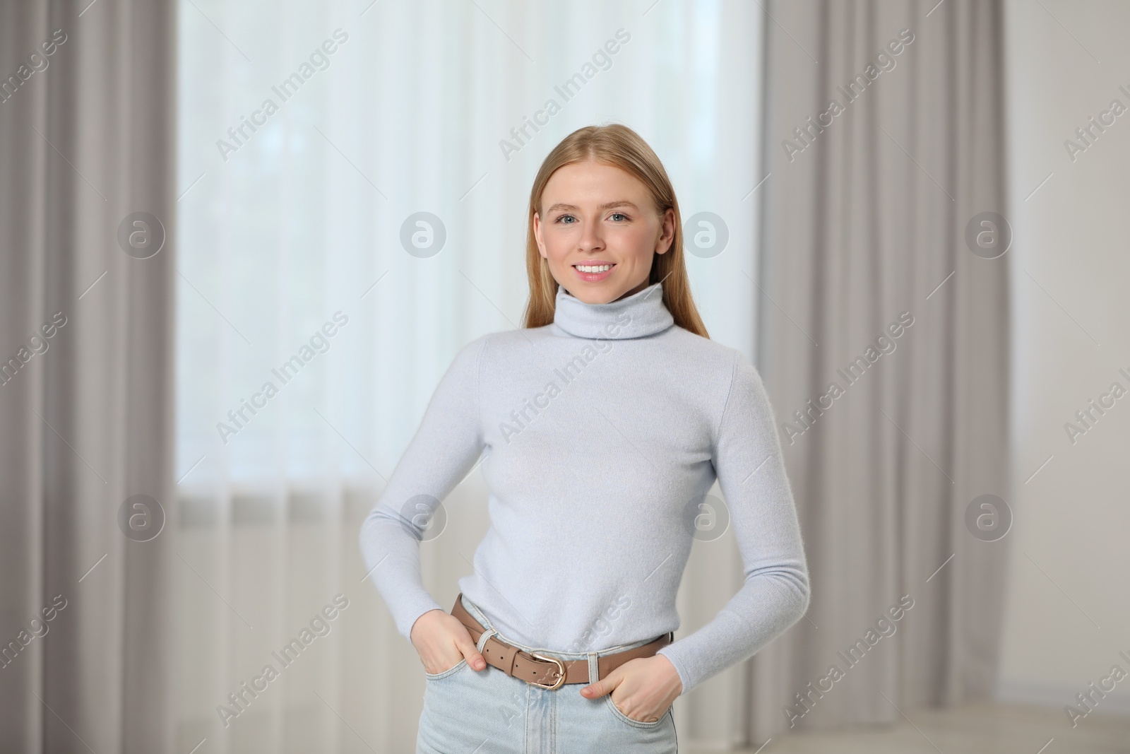 Photo of Portrait of beautiful young woman at home