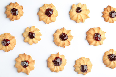 Tasty shortbread cookies with jam on white background, top view