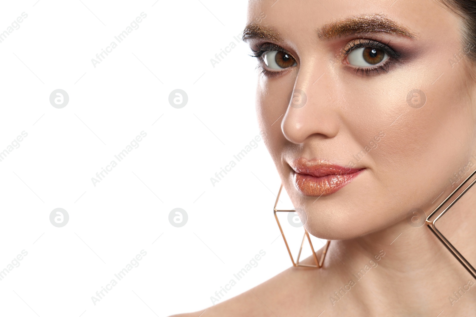 Photo of Beautiful young woman with glitter makeup on white background