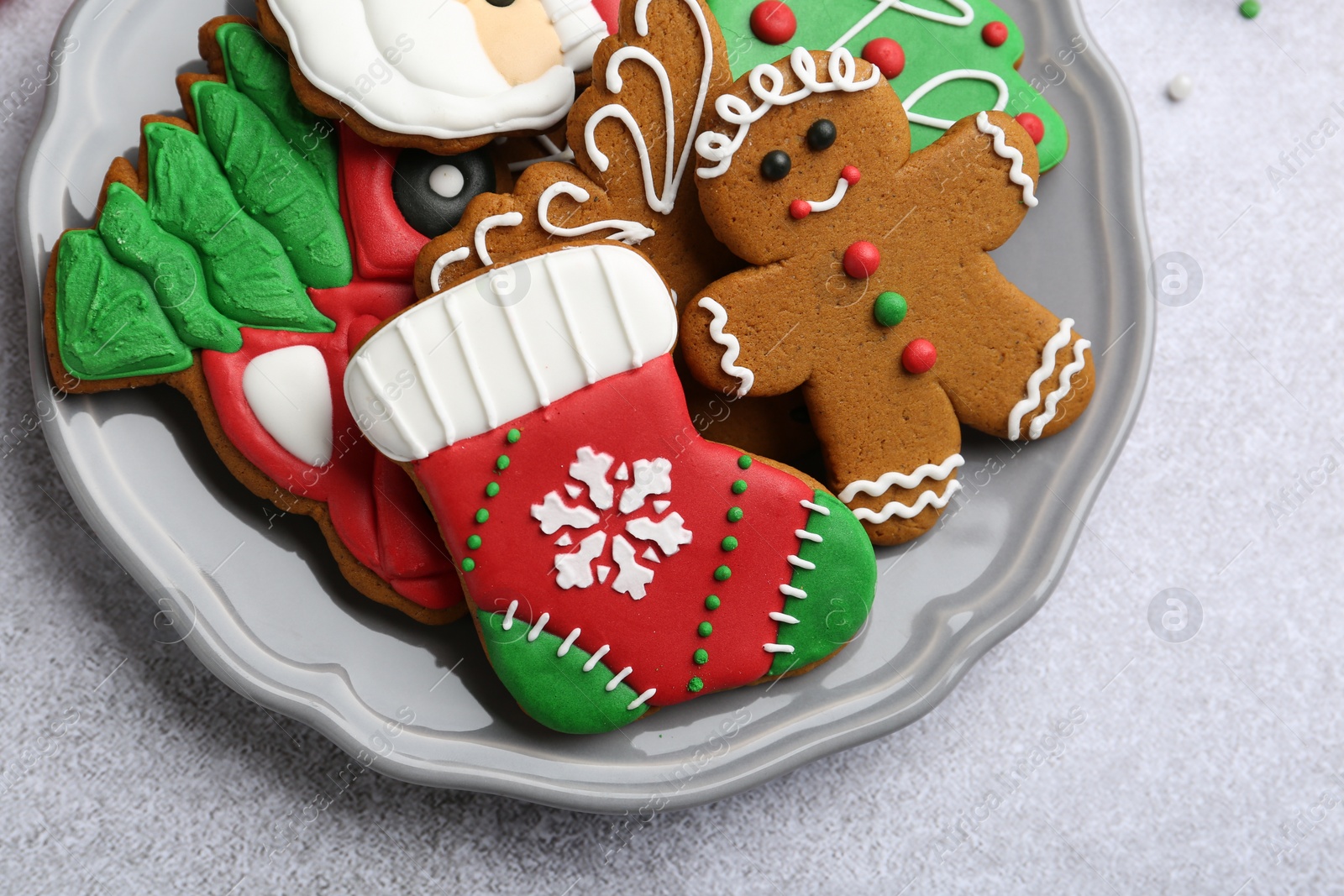 Photo of Tasty homemade Christmas cookies on light grey table, top view