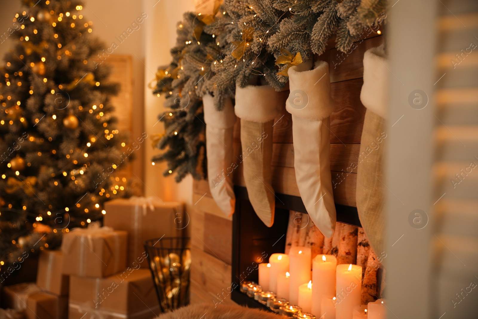 Photo of Stylish room interior with decorative fireplace. Christmas time