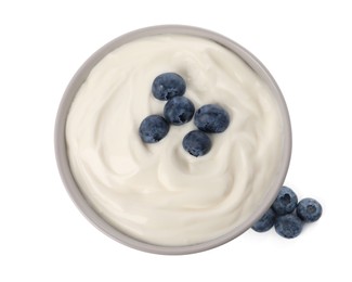Photo of Bowl of delicious yogurt with blueberries on white background, top view