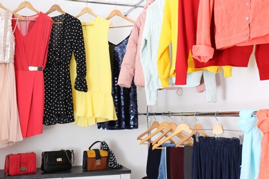 Modern dressing room with different stylish clothes and accessories