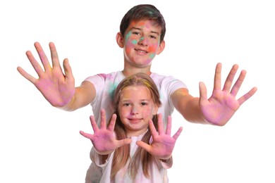 Photo of Friends covered with colorful powder dyes on white background. Holi festival celebration