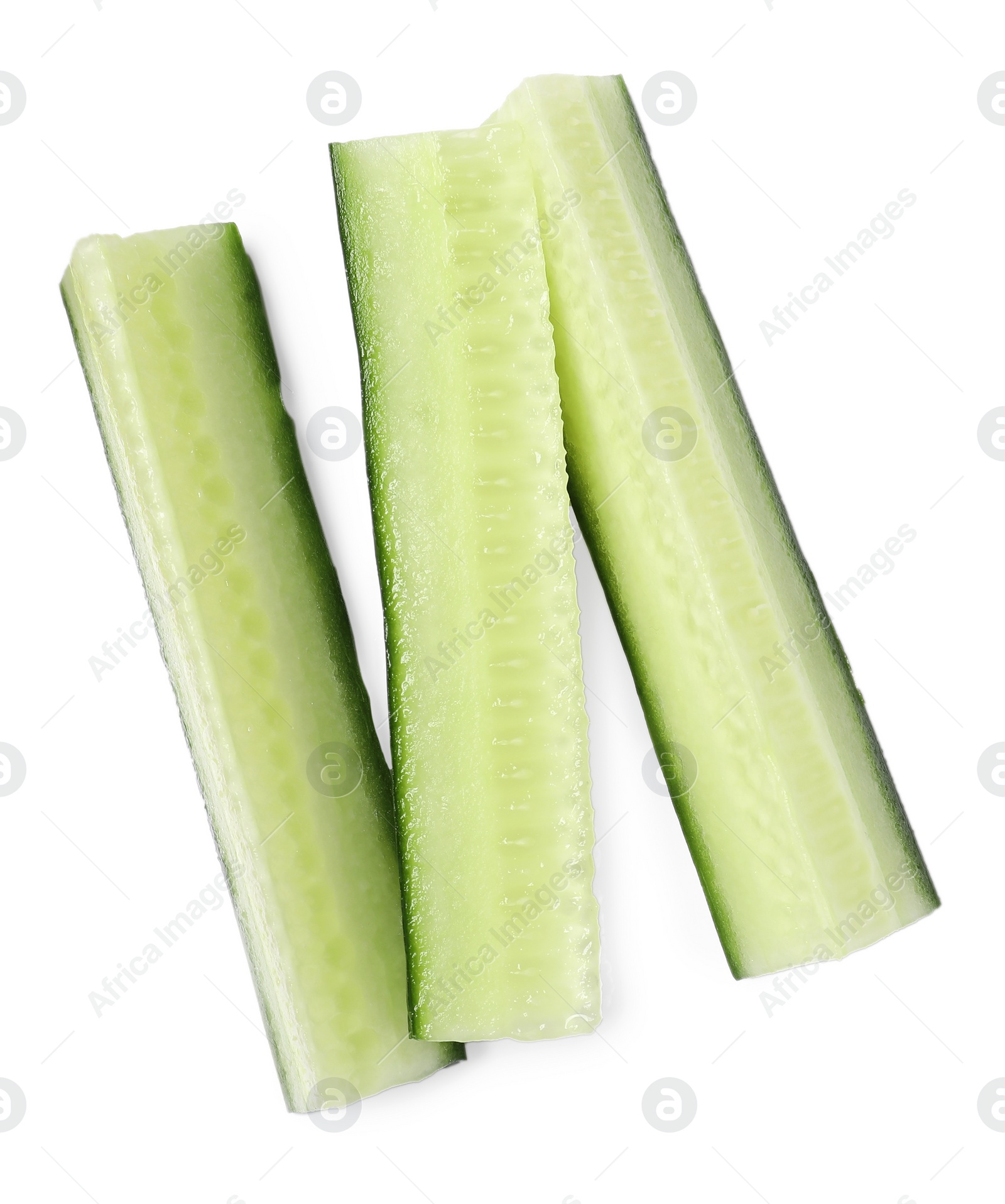 Photo of Pieces of fresh cucumber isolated on white, top view