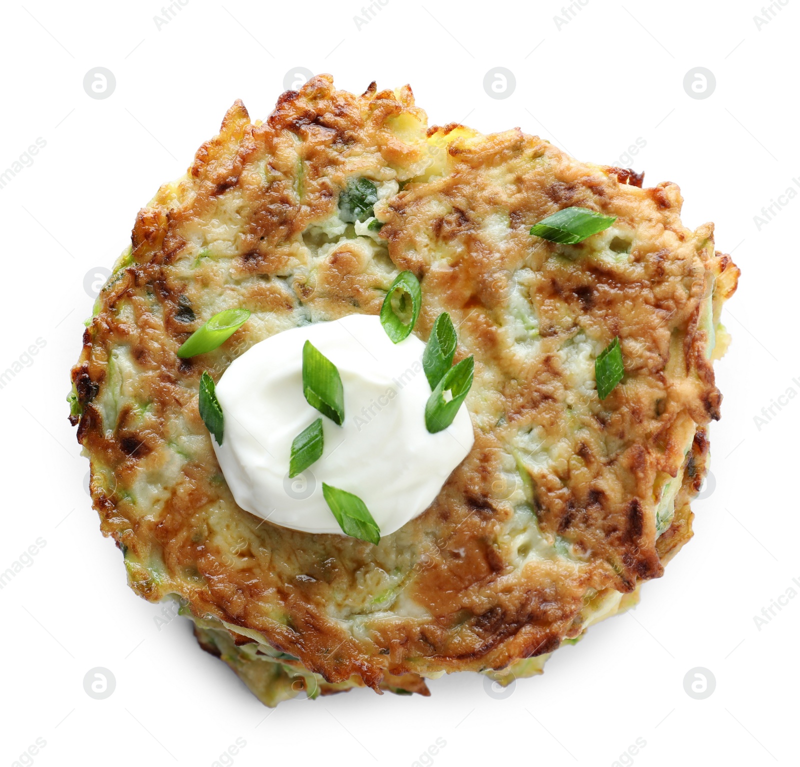 Photo of Delicious zucchini fritters with sour cream and onion on white background, top view