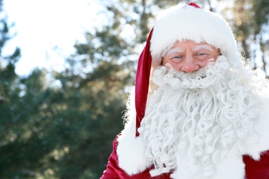 Photo of Happy Authentic Santa Claus outdoors, space for text