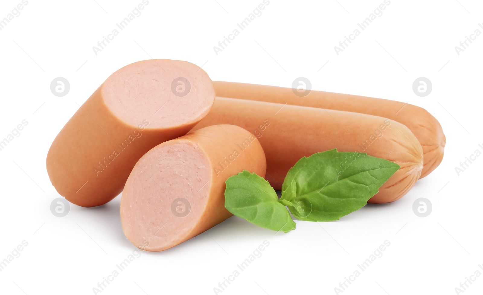 Photo of Whole and cut delicious boiled sausages with basil on white background