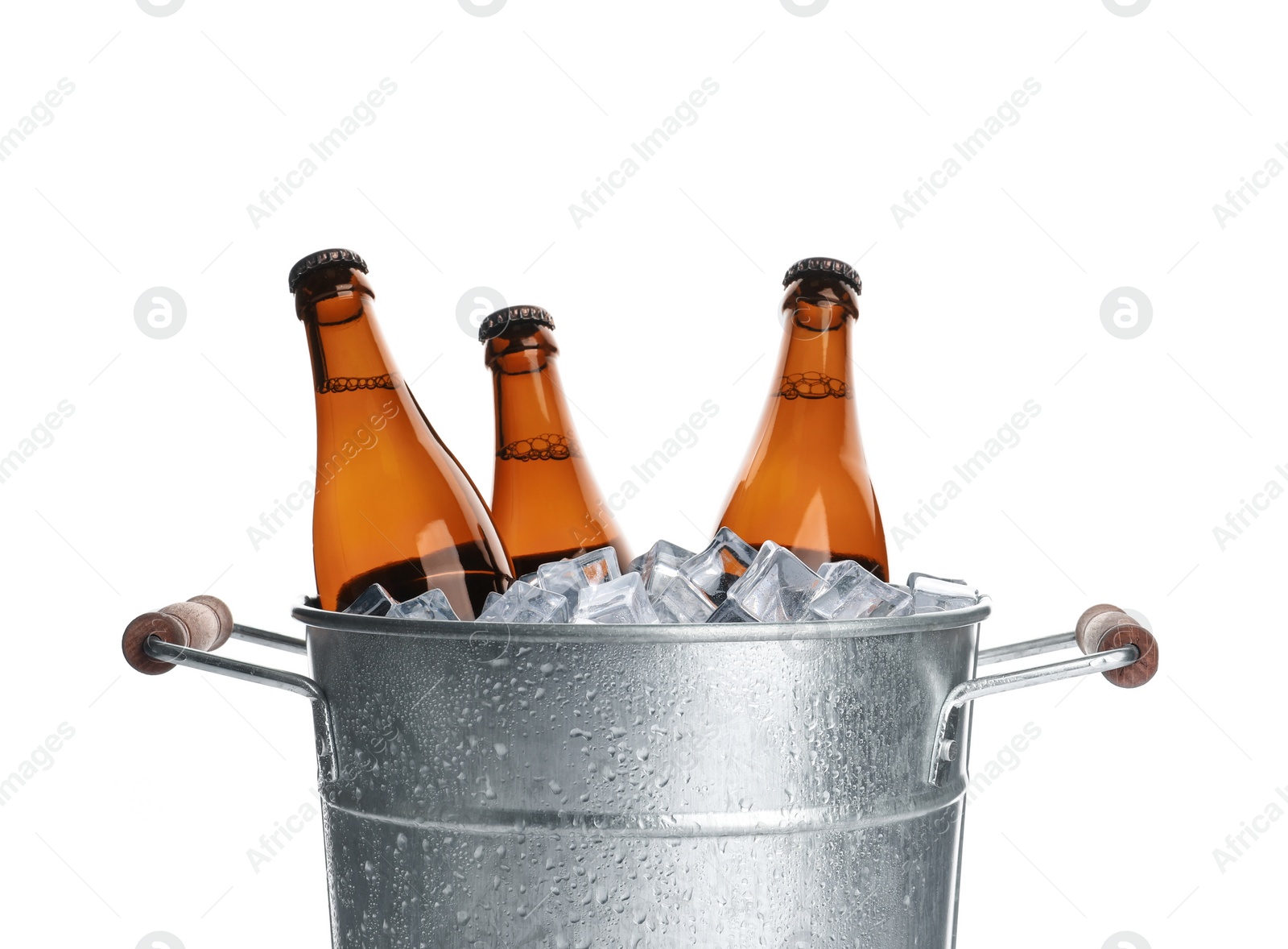 Photo of Metal bucket with bottles of beer and ice cubes isolated on white