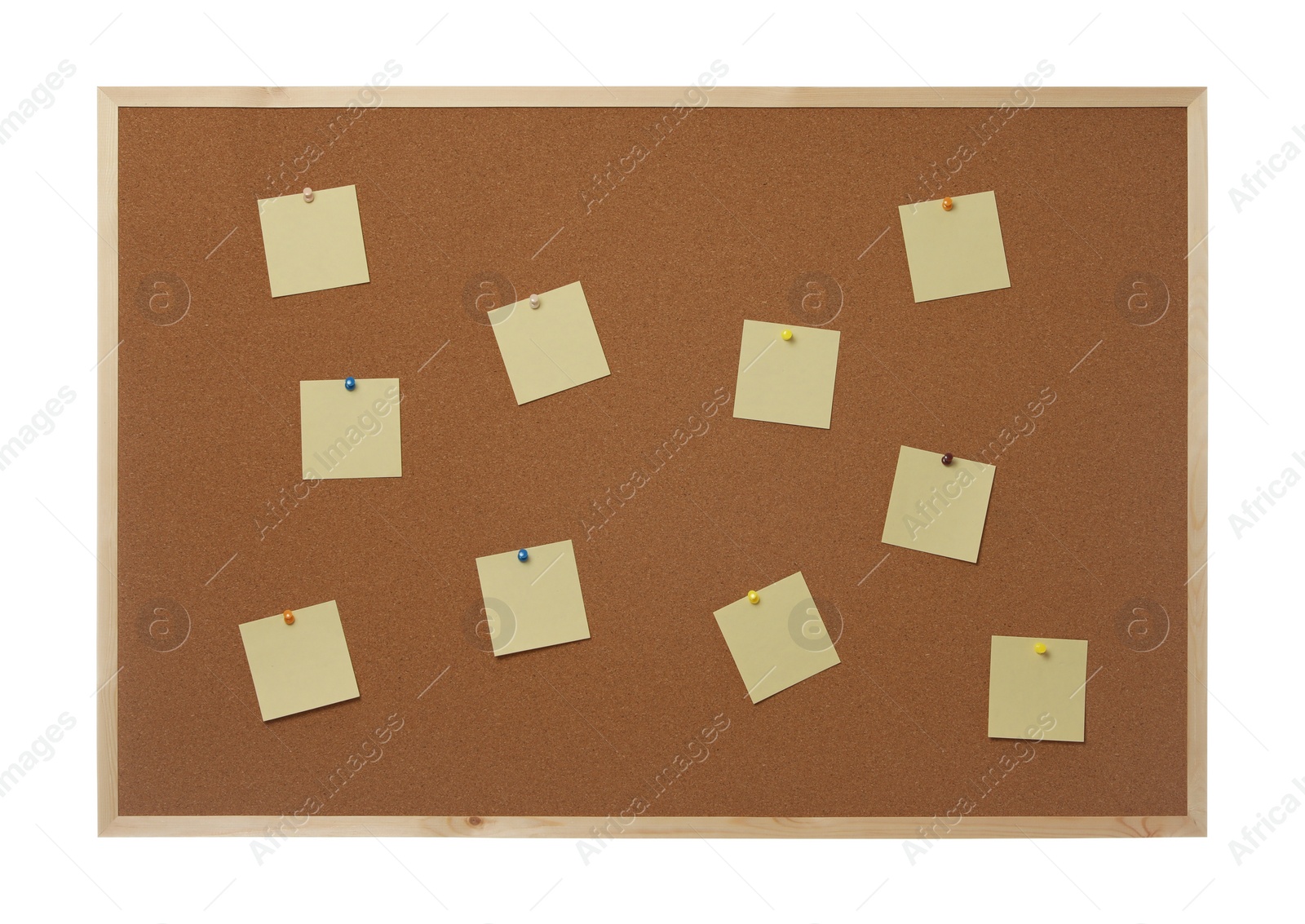 Photo of Empty notes pinned to cork board on white background