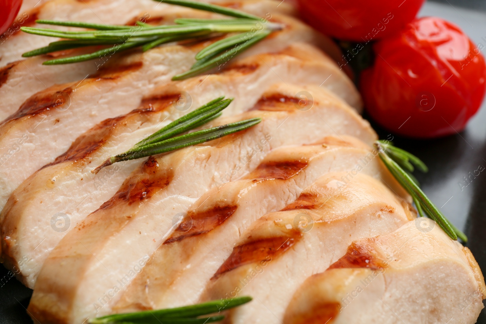 Photo of Tasty grilled chicken fillet with rosemary on plate, closeup