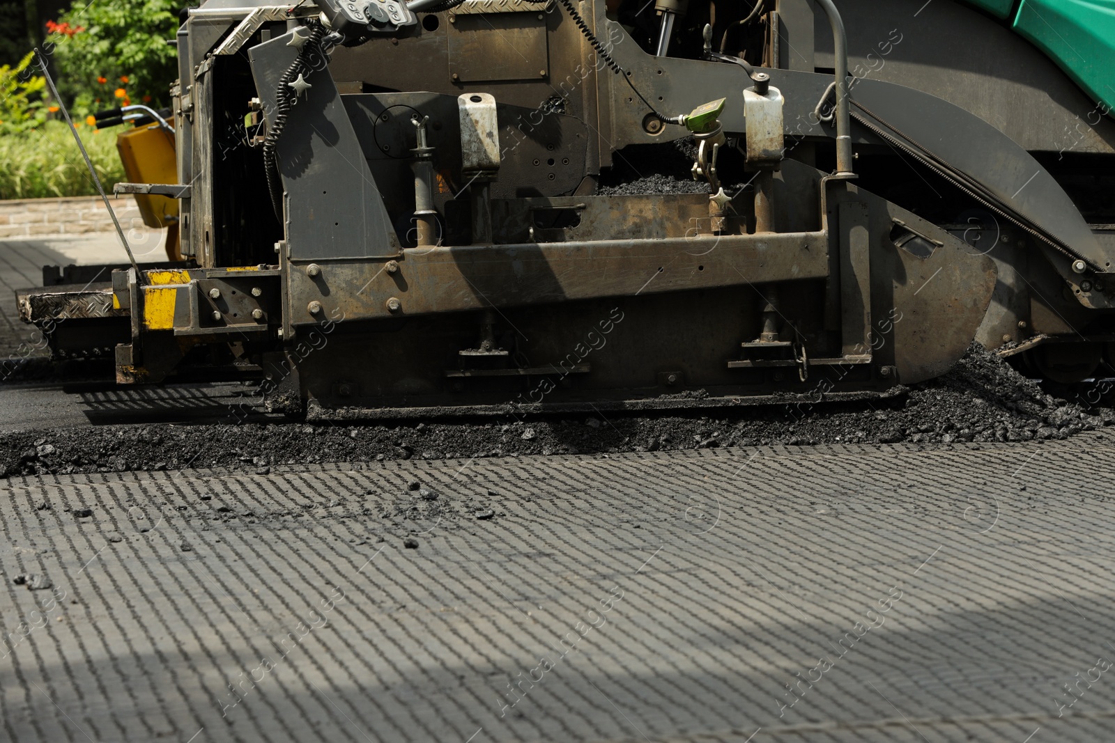 Photo of Road repair machinery working outdoors, closeup view