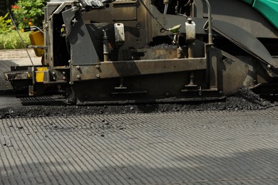 Photo of Road repair machinery working outdoors, closeup view