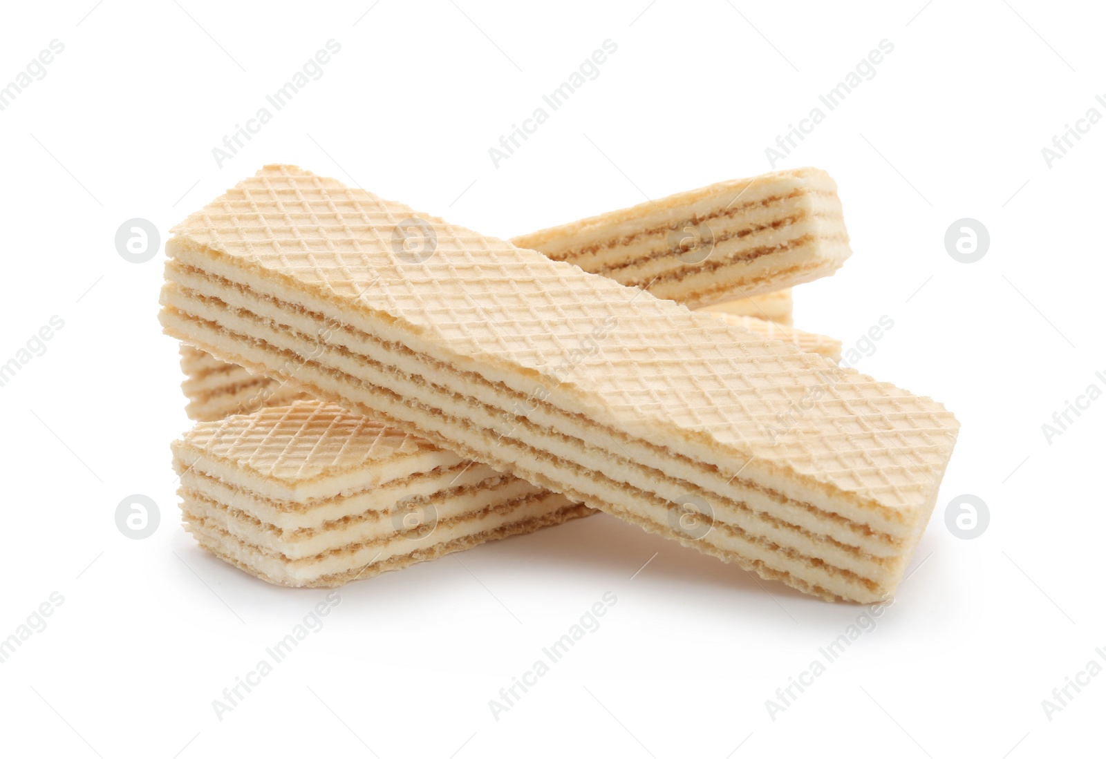 Photo of Delicious vanilla wafer sticks isolated on white