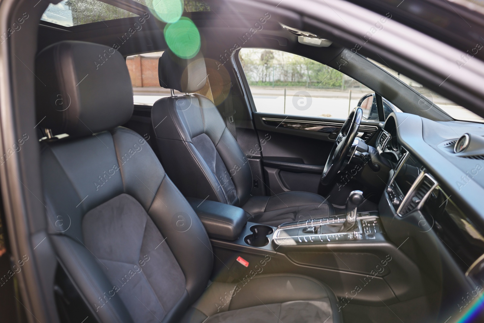 Photo of Inside of modern black car with leather seats