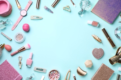 Photo of Frame of cosmetic products and accessories on light blue background, flat lay. Space for text