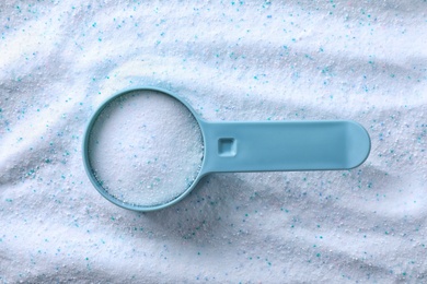 Photo of Measuring spoon with laundry powder, top view