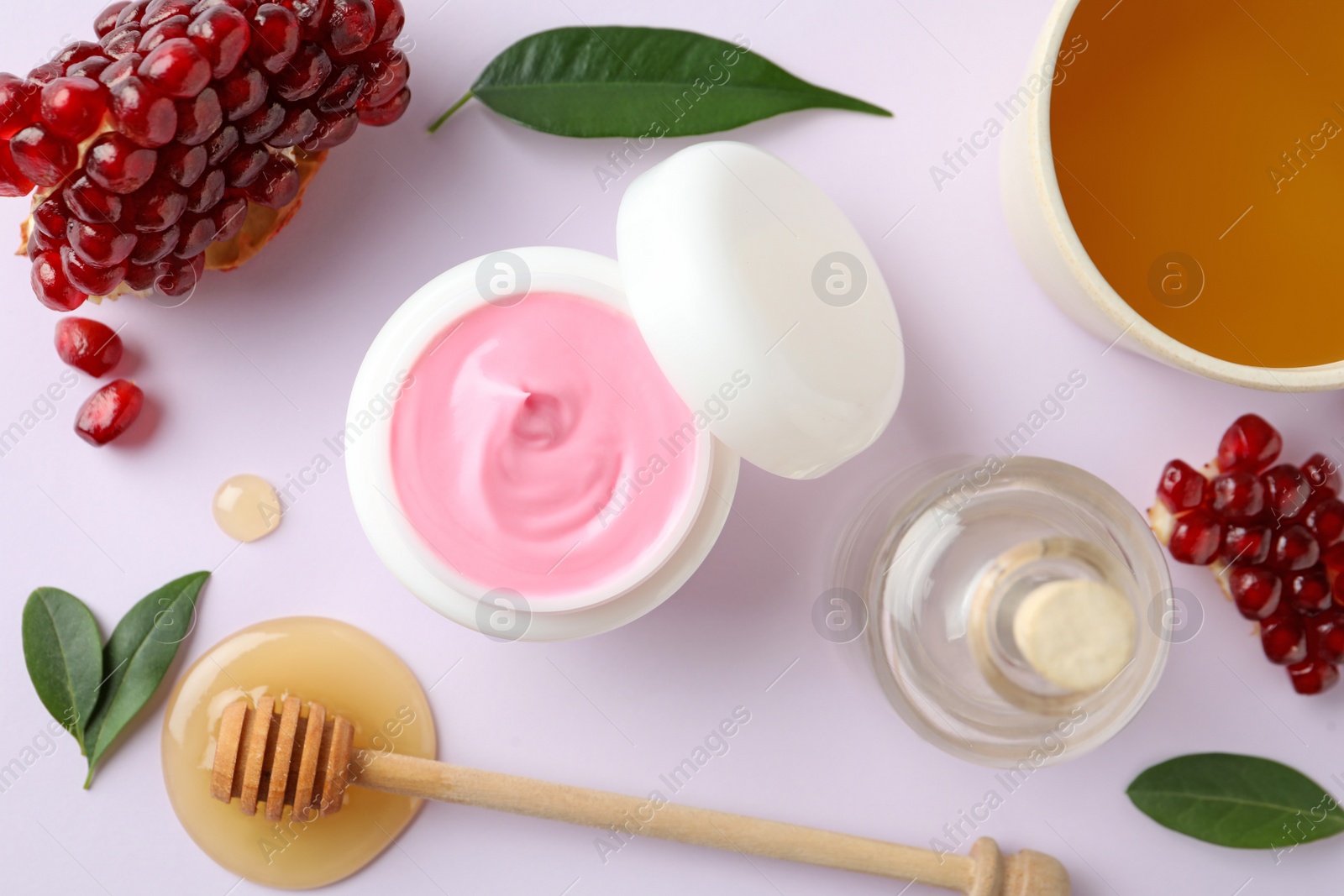 Photo of Composition with natural homemade mask, pomegranate and ingredients on white background, top view