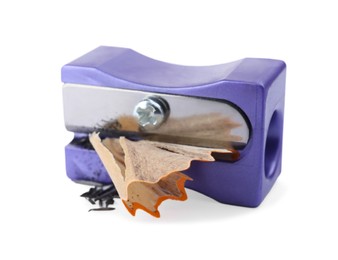 Violet sharpener with pencil shavings on white background