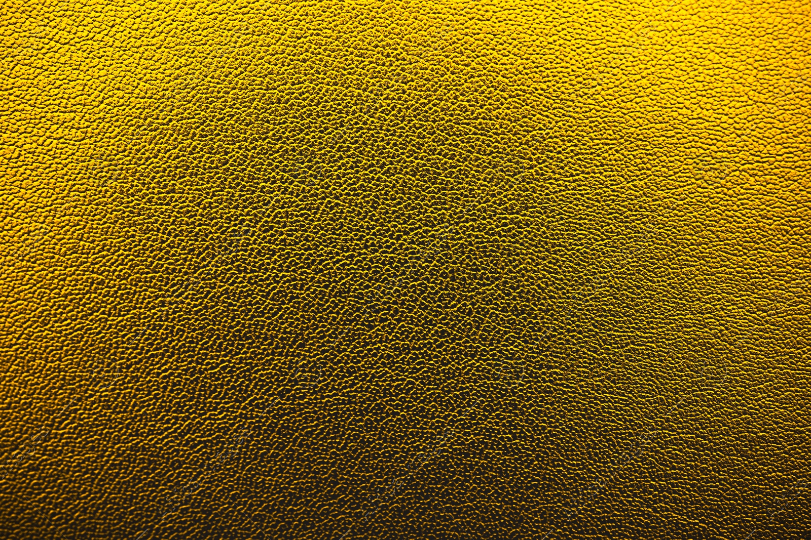 Image of Golden textured surface as background, closeup view