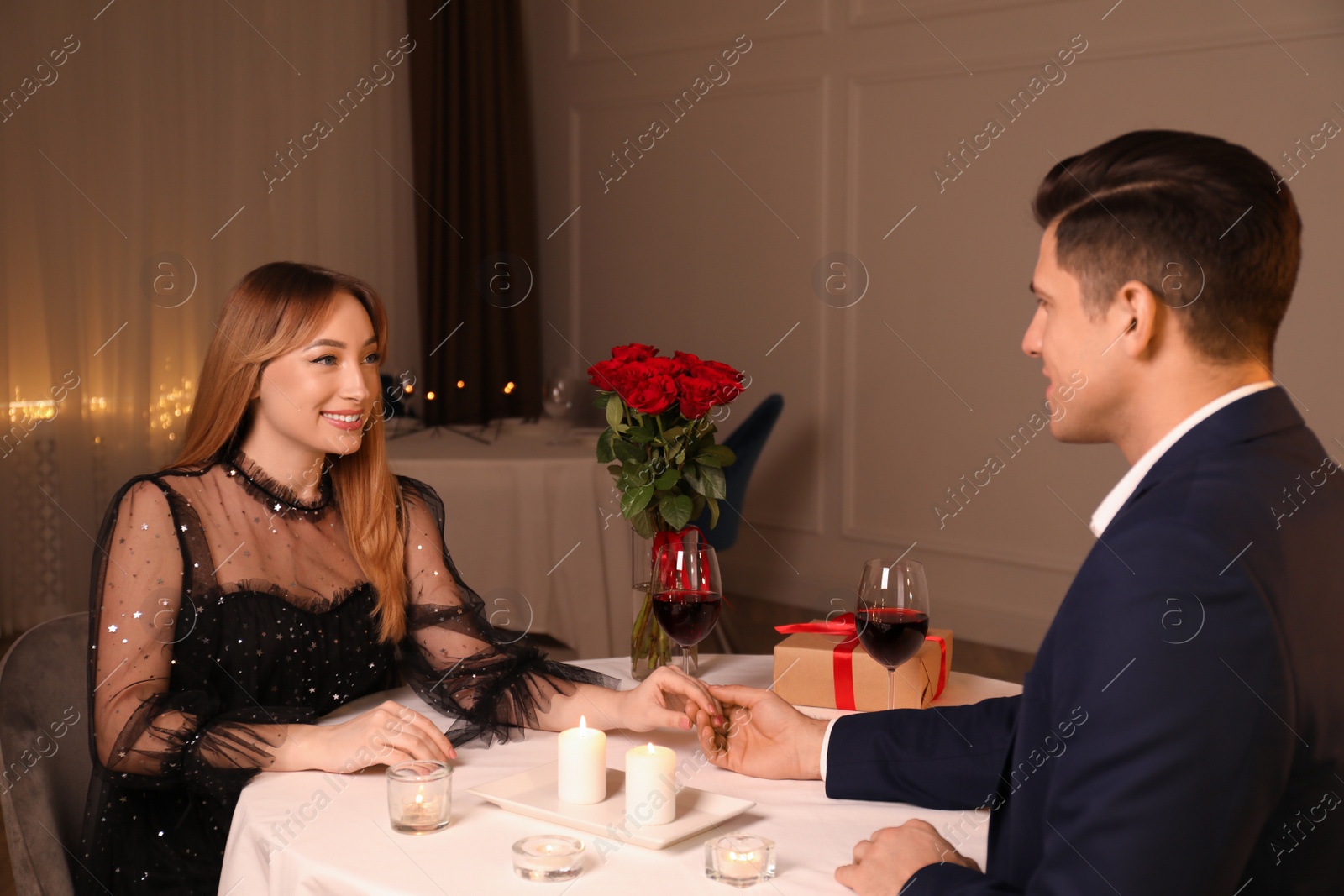 Photo of Lovely couple having romantic dinner in restaurant