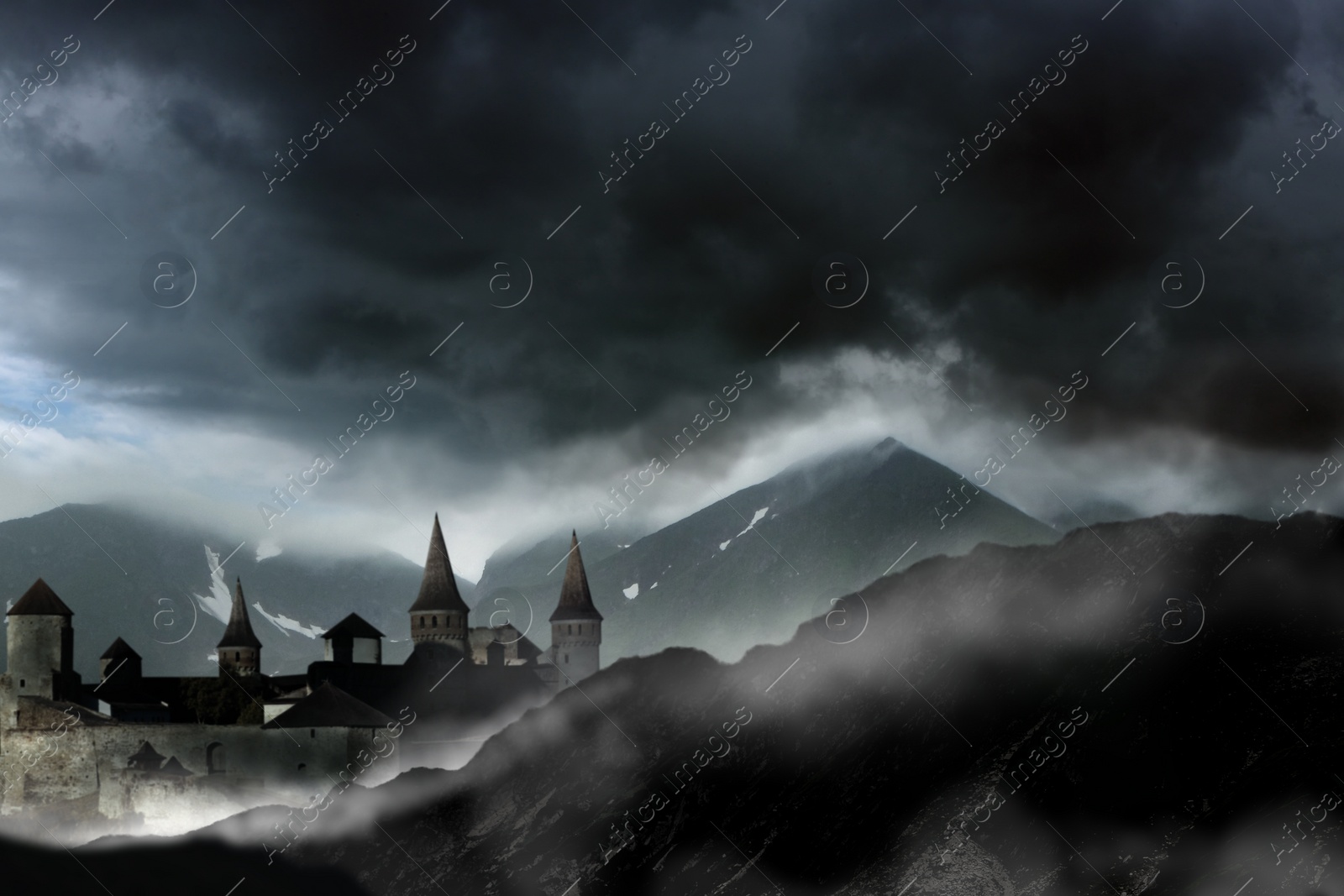 Image of Fantasy world. Mystical castle and mountains covering with fog in night