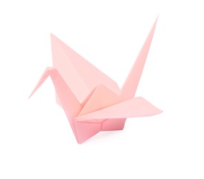Photo of Origami art. Beautiful pale pink paper crane isolated on white