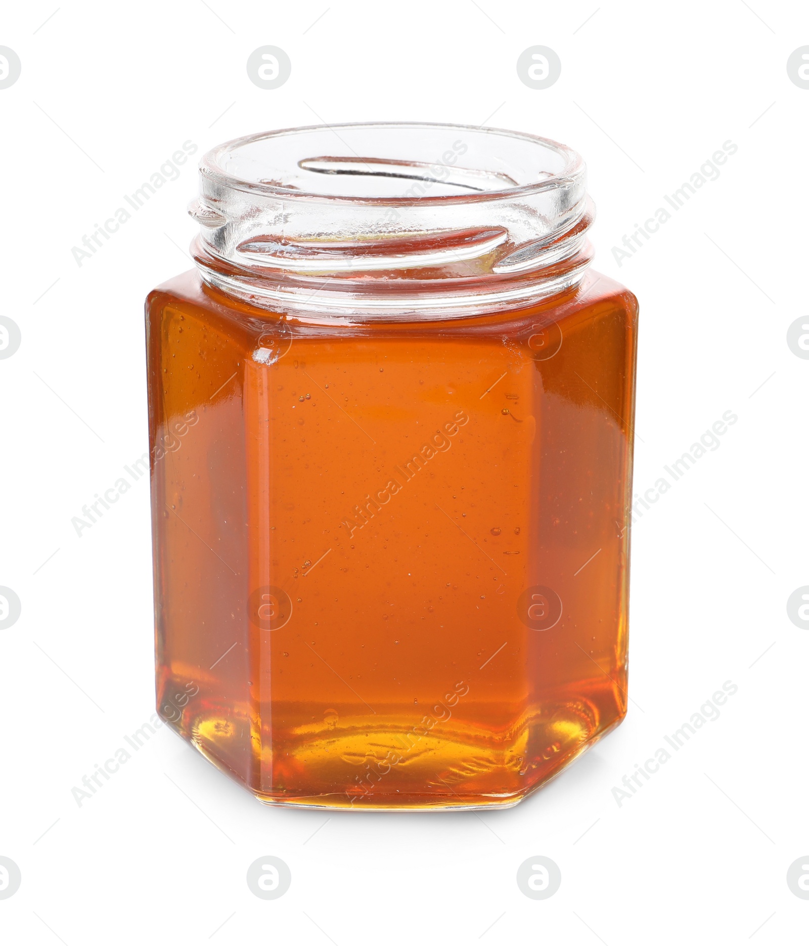 Photo of Tasty natural honey in glass jar isolated on white