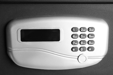 Photo of Black steel safe with electronic lock, closeup