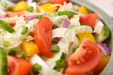 Photo of Tasty salad with Chinese cabbage, tomato and bell pepper in bowl, closeup