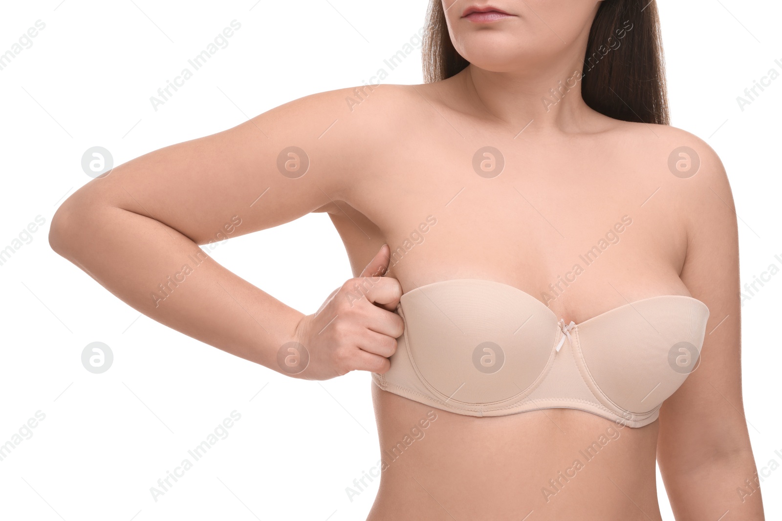 Photo of Mammology. Woman in bra doing breast self-examination on white background, closeup