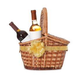 Festive basket with bottles of wine on white background