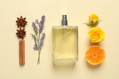 Photo of Flat lay composition with bottle of perfume and fresh citrus fruit on beige background