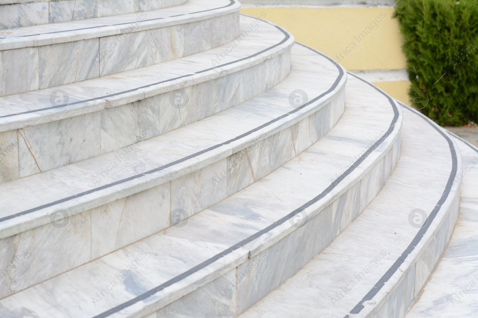 Photo of Tiled stone stairs outdoors, closeup. Entrance design