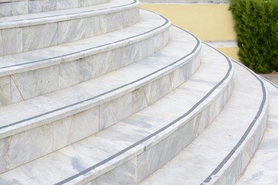 Tiled stone stairs outdoors, closeup. Entrance design