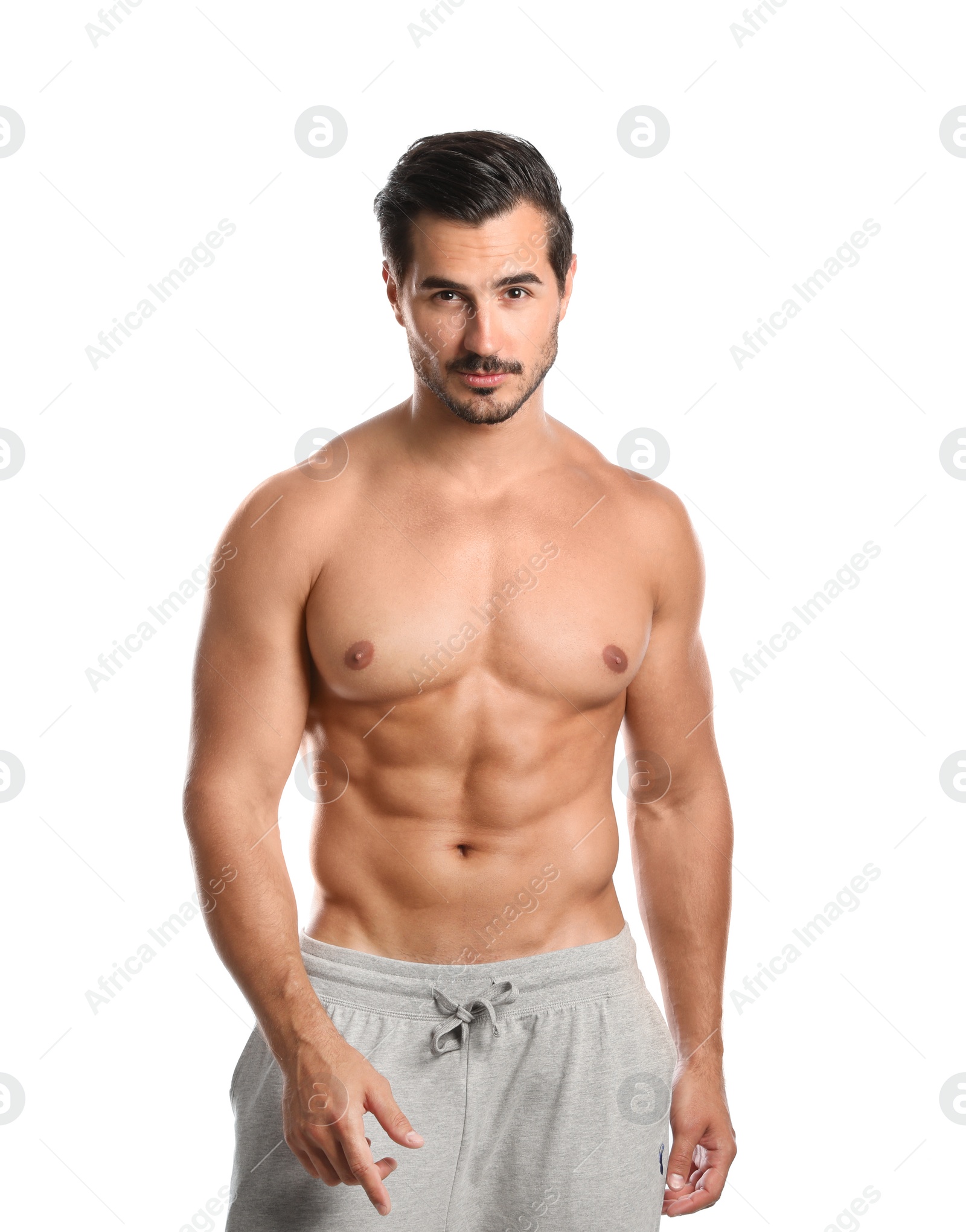 Photo of Young man with slim body on white background