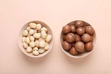 Photo of Delicious organic Macadamia nuts on beige background, flat lay