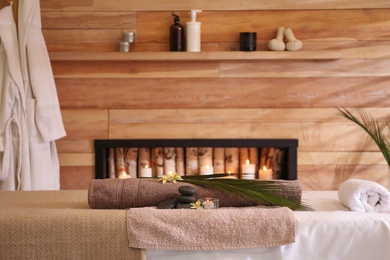 Photo of Beautiful spa accessories in stylish massage room