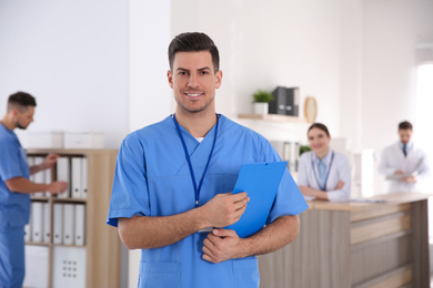 Portrait of male doctor in modern clinic