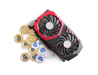 Photo of Modern video card and bitcoins isolated on white, top view