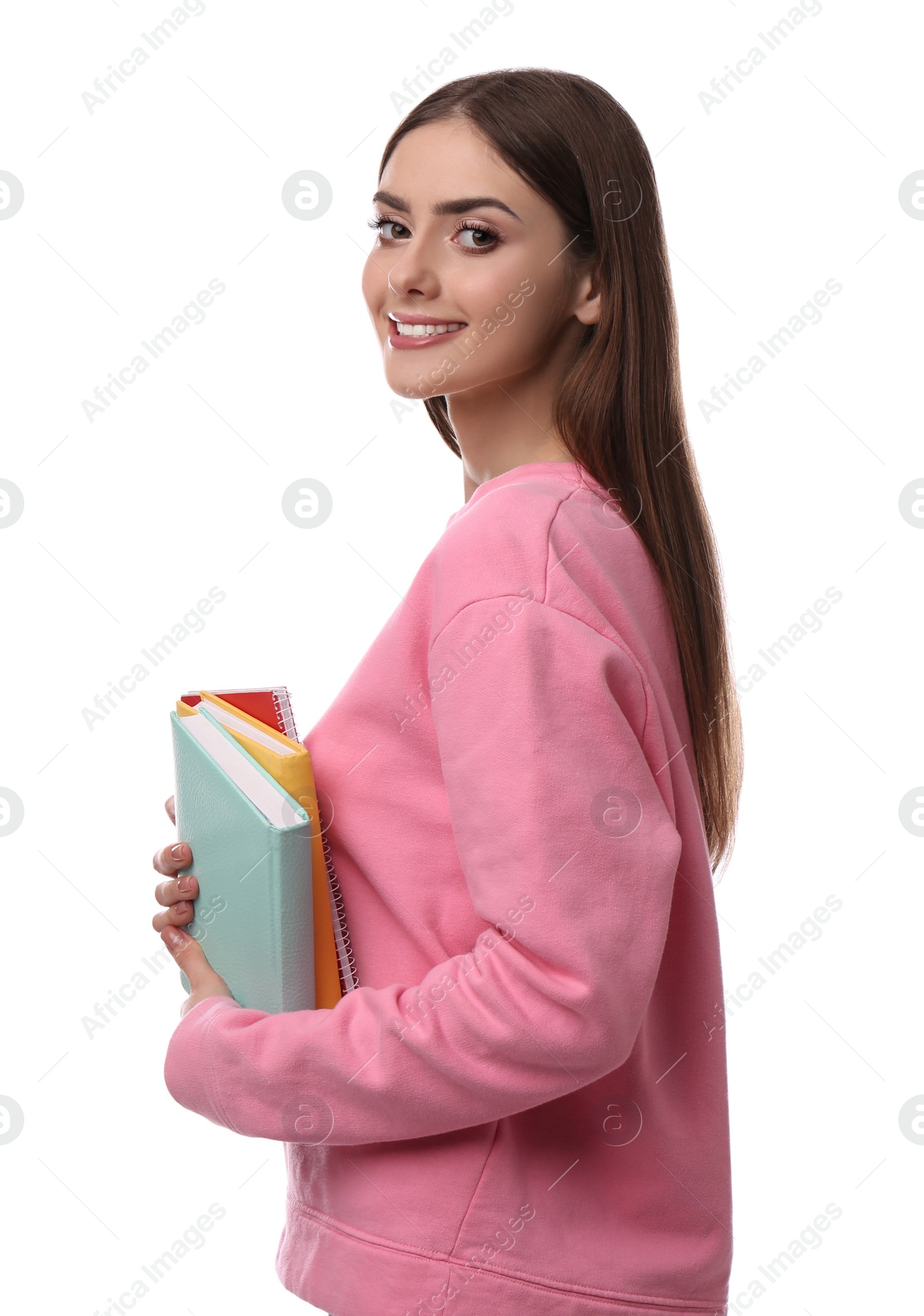 Photo of Teenage student holding books on white background